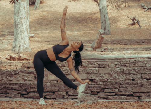 Woman in workout clothes stretching